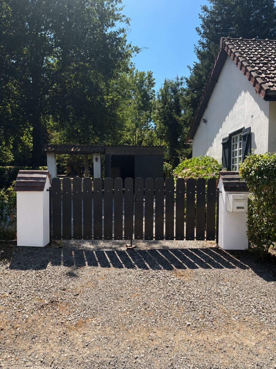 Handmade black timber picket driveway gate, personal project